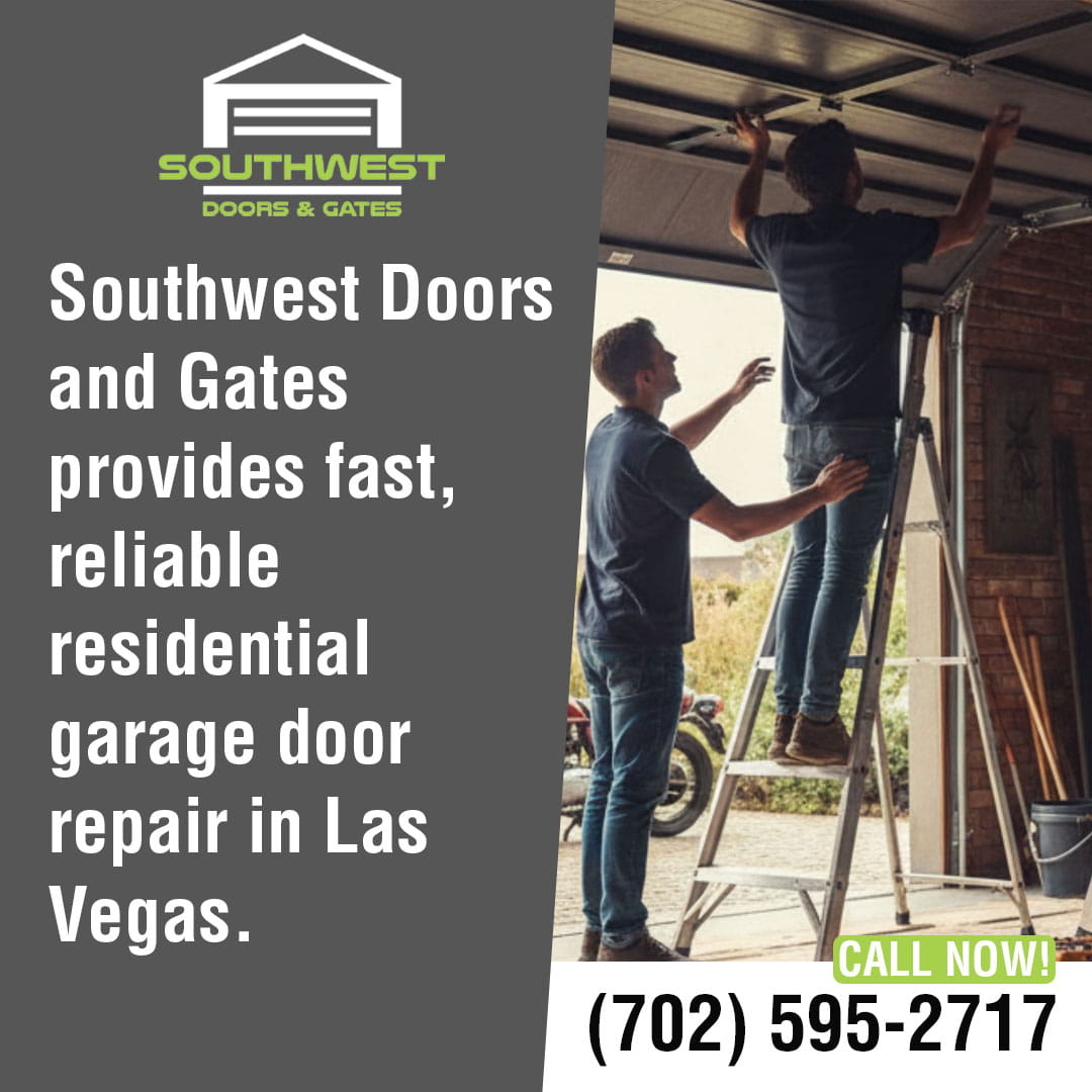 Technicians repairing a residential garage door in Las Vegas.