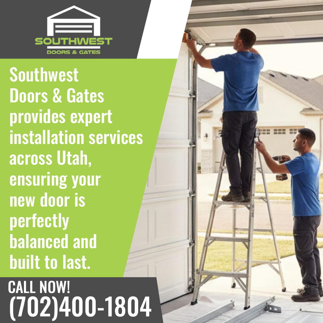 Two technicians installing a residential garage door, one on a ladder adjusting the track while the other assists with tools.
